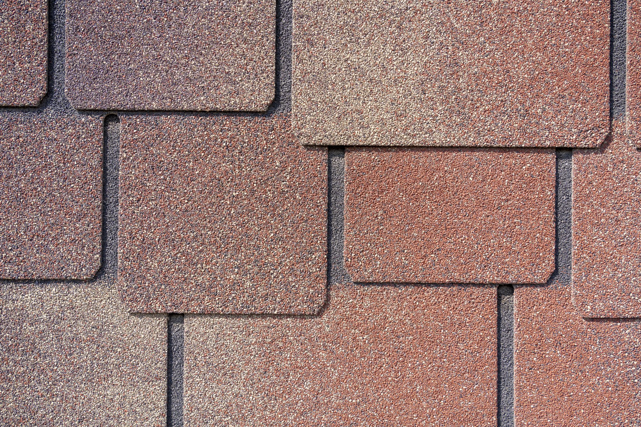Close-Up of Granular Roof Shingles Texture on Building Roof
